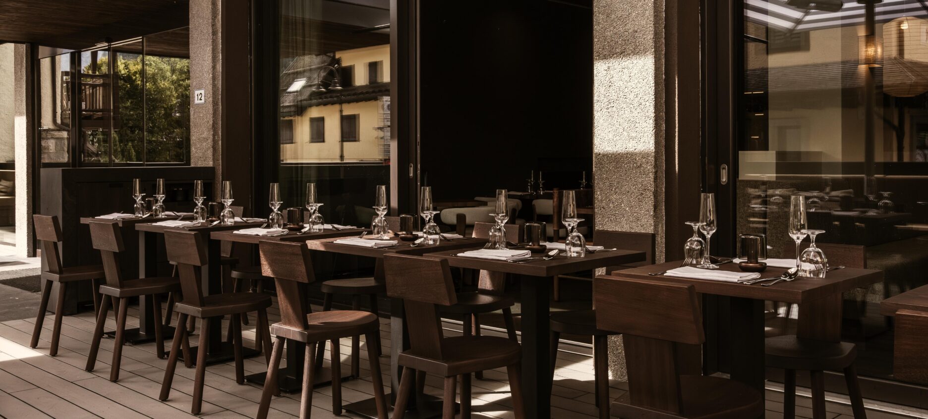 The outdoor terrace with seating and umbrellas