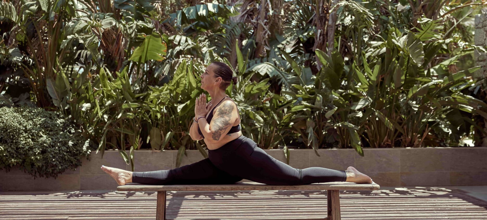 Woman stretching and engaging her core in a yoga pose