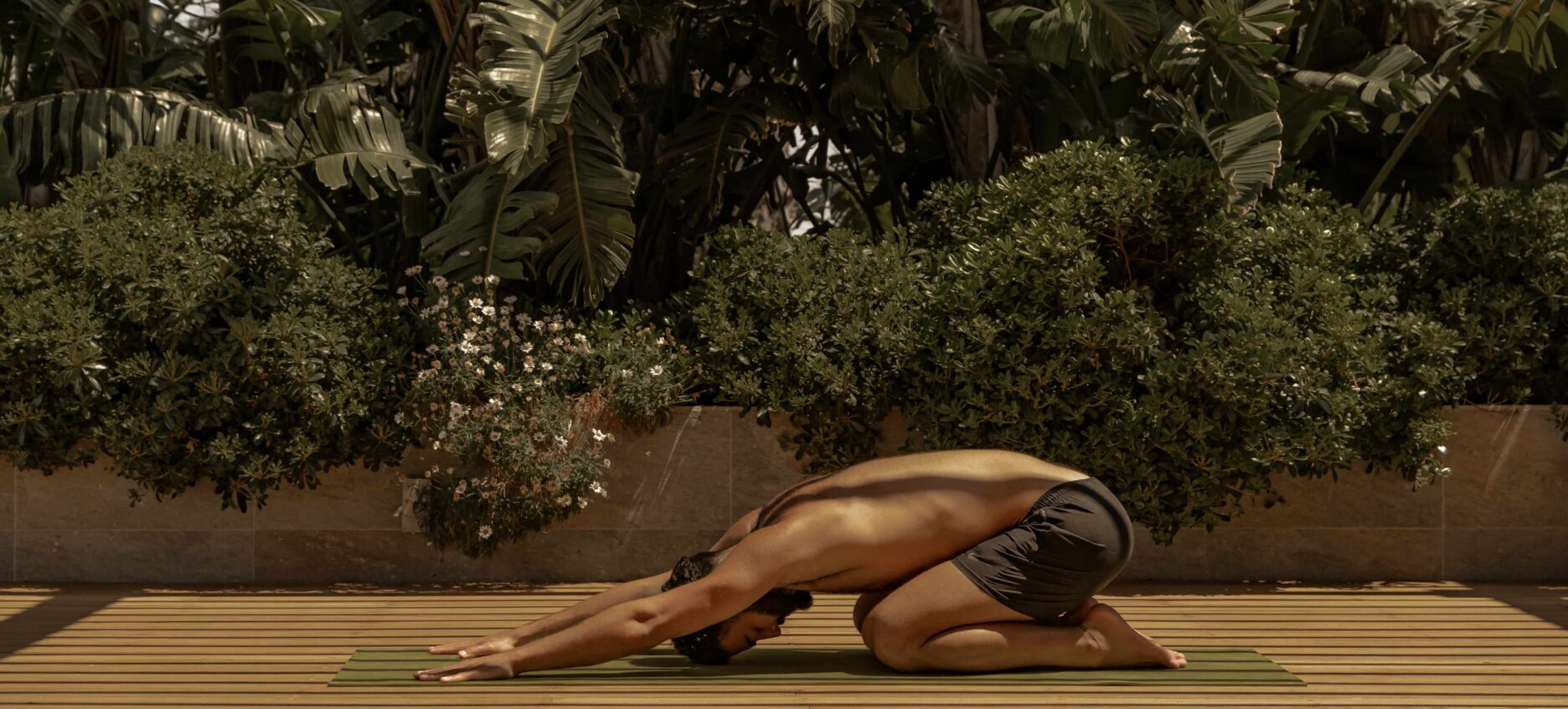 Person practicing yoga and in childs pose